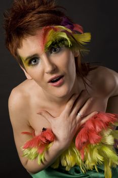 fashion model with feather on face