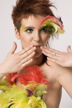 fashion model with feather on face