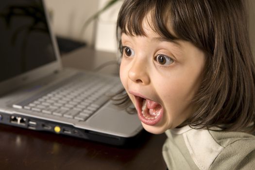 young child working in computer