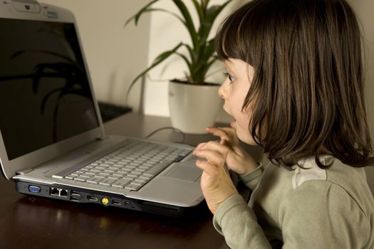 young child working in computer