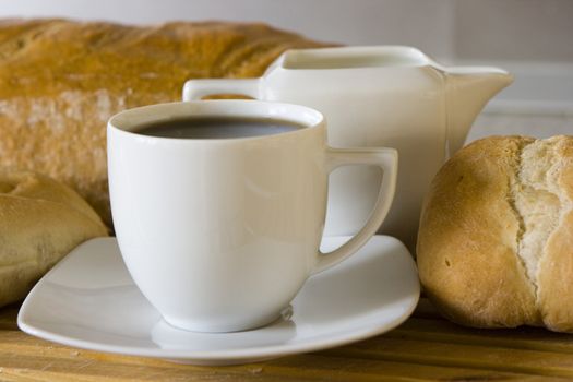 Breakfast with coffe, milk and bread