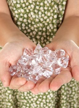 image of someone holding two handfuls of diamonds