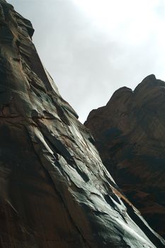 Grey rock of the Grand Canyon and a grey blue sky
