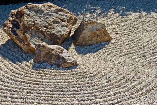 japanese rock garden showing raked gravel stones