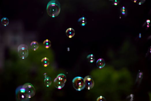 Bubbles floating around at night