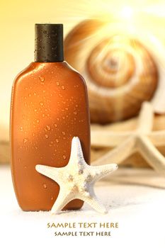Suntan lotion and seashells with sunny  background