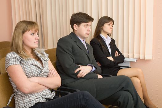 Group of skeptical businessmen in conference hall