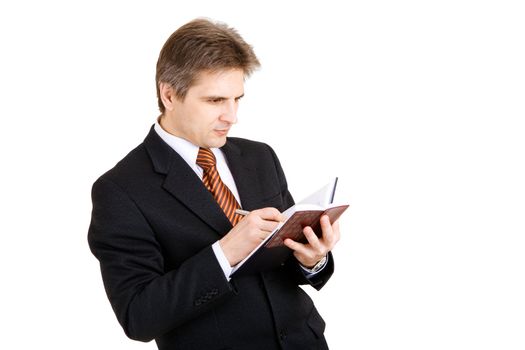 businessman writing something in his notebook