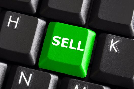 sell written on keyboard showing business or finance concept