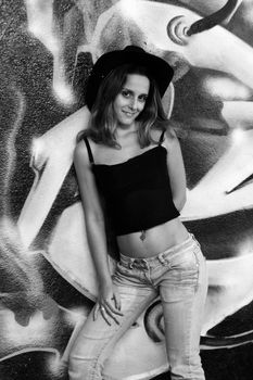 cowboy fashion girl in graffiti background