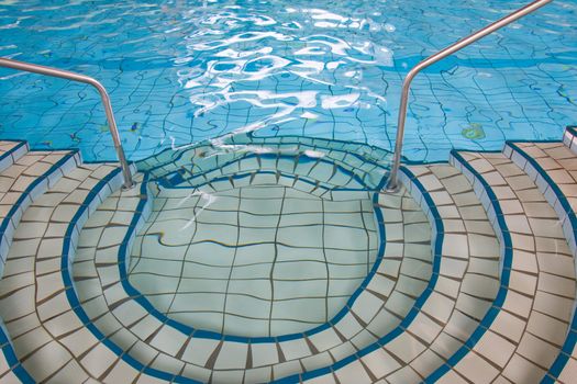 Picture of indoor swimming pool with interesting details.