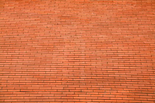 background or pattern of a big red orange brick wall