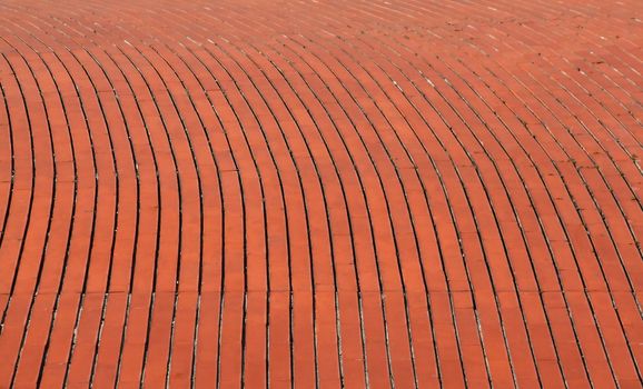 background of a curve red orange brick wall