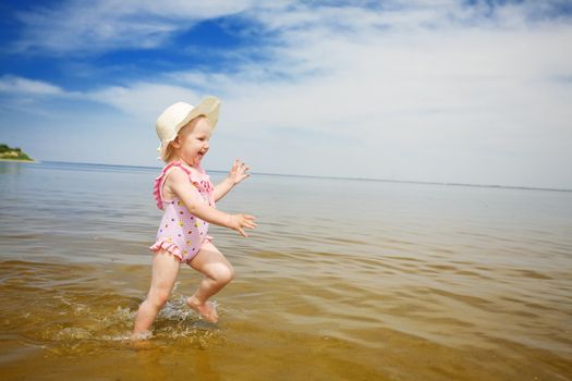 happy girl running in the beach