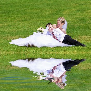 rest of newly married couple near the lake