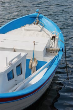 white fishing boa,  moored on the water