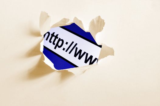 internet concept behind hole in blank paper