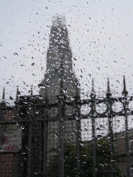 View thru the wet glasses of Perret Tower on a rainy day in Amiens, part of the Le Picardie, France.