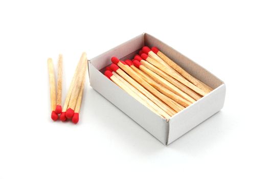Some red matches isolated on a white background.