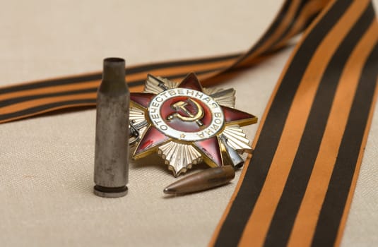 Bullet, shell casing Order of the Patriotic War and the Ribbon of Saint George.