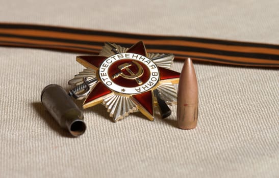 Bullet, shell casing Order of the Patriotic War and the Ribbon of Saint George.