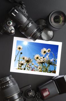 camera and lense on black showing photographer still life