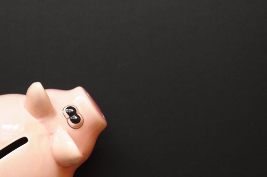 piggy bank and blank or empty black copyspace