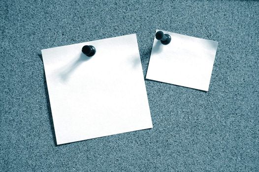 blank and empty sheet paper with pin on bulletin board