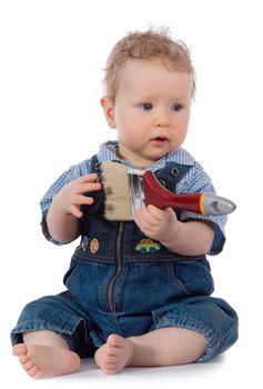 Beautiful baby with paint brush on white