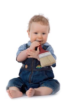 Beautiful baby with paint brush on white