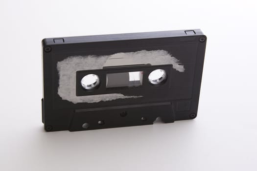 old tape cassette with cover sticker rip apart