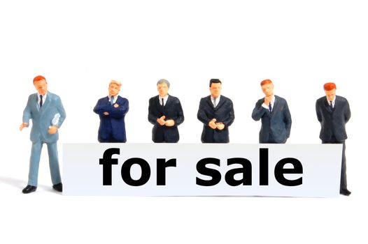 for sale concept with toy business man isolated on white background