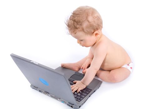 baby with laptop on white
