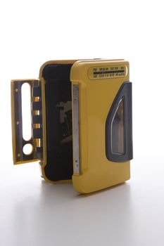 vintage yellow cassette player with door open