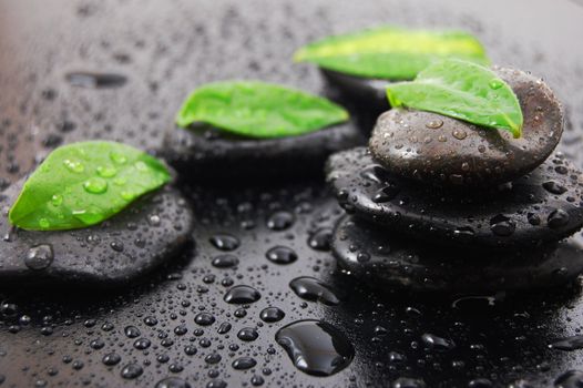 wellness massage or bath concept with zen stones leafes and water drop