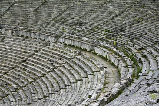 Close up of stone seats in Greek ancient theatre of Epidauros.