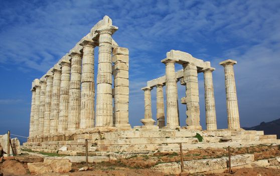 Ruins of ancient Greek Temple of Poseidon, god of the sea in ancient mythology. It is located at Cape Sounion, near Athens, Greece, and was built in ca.440 BC.