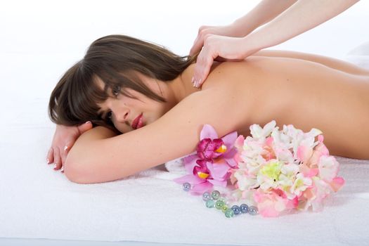 Attractive woman getting spa treatment on white