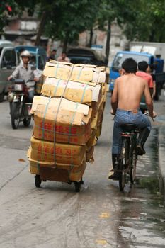 Typical street scene in China with a carrier