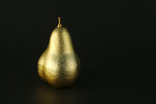 Golden Pears on a black background.