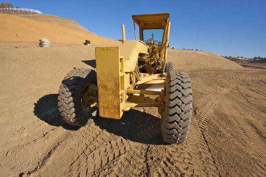 Tractor at a Cunstruction Site and dirt lot.