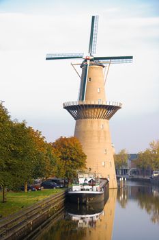 Ship and mill on a sunny autumn morning