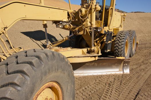 Tractor at a Cunstruction Site and dirt lot.