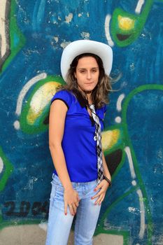 cowboy fashion girl in graffiti background