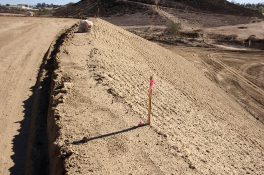 Sandbags & Marker Sticks at a Construction Site and dirt lot.