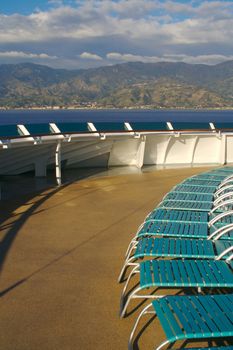 Cruise ship deck abstract shot with deck chairs.