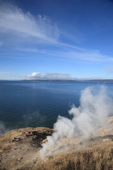Steaming geyser on shore of Yellowstone Lake