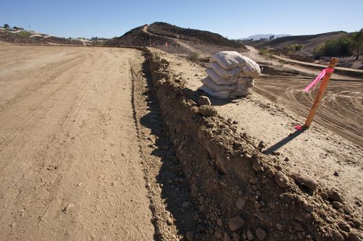 Sandbags  & Marker Sticks at a Cunstruction Site and dirt lot.