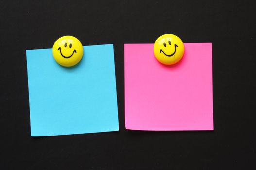 smilie or smily with empty sheet of paper and copyspace