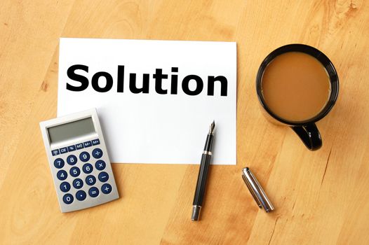 business solution concept with pen paper and coffee in office